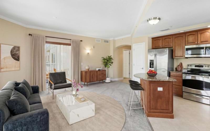 a large living room with a large kitchen and a dining table