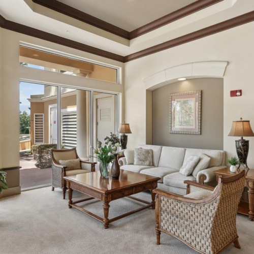 a living room with a large glass door
